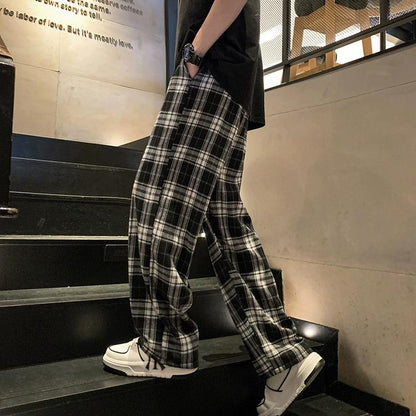 Pantalones holgados unisex de cintura elástica a cuadros negros de gran tamaño