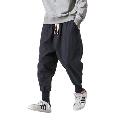 Cós elástico liso, estilo jogger, caimento solto, virilha baixa