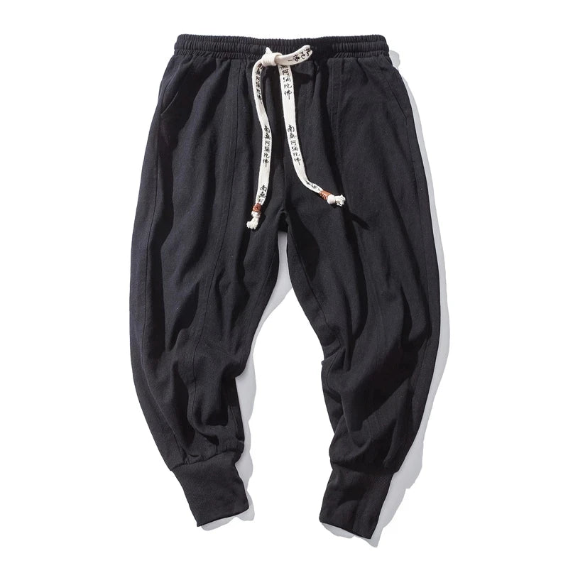 Cós elástico liso, estilo jogger, caimento solto, virilha baixa