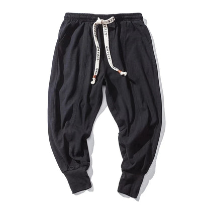 Cós elástico liso, estilo jogger, caimento solto, virilha baixa