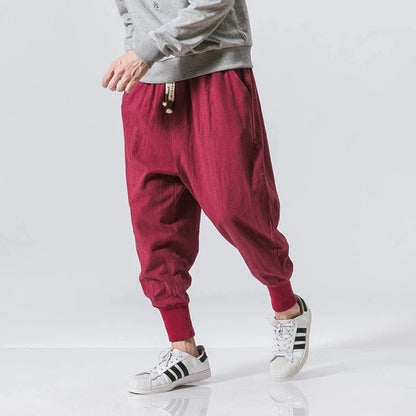 Cós elástico liso, estilo jogger, caimento solto, virilha baixa
