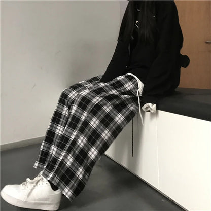 Pantalones holgados unisex de cintura elástica a cuadros negros de gran tamaño