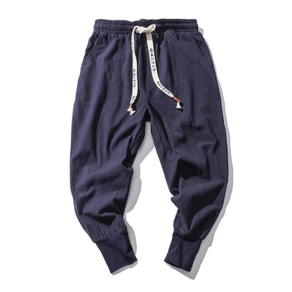 Cós elástico liso, estilo jogger, caimento solto, virilha baixa