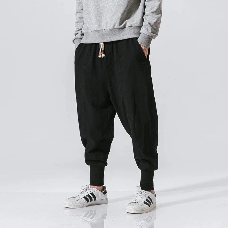 Cós elástico liso, estilo jogger, caimento solto, virilha baixa
