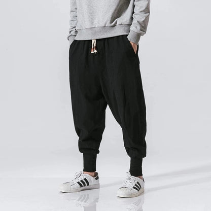 Cós elástico liso, estilo jogger, caimento solto, virilha baixa
